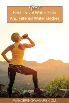 a woman drinking water from a bottle while standing on top of a mountain with the words best travel water filter and filtered water bottles