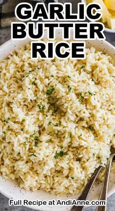 garlic butter rice in a white bowl with spoons on the side and text overlay that reads garlic butter rice