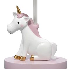 a white and pink carousel horse with gold trimmings on it's head