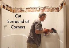 a man working on a shower in a bathroom with the words cut surround at corners