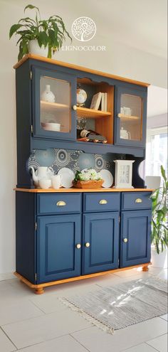 a blue china cabinet in a living room