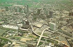 an aerial view of a city with lots of tall buildings