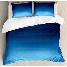 blue and white bedding with two pillows