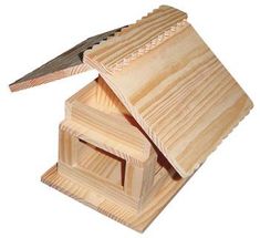 a wooden birdhouse with a knife sticking out of it's roof