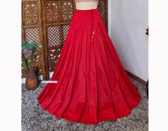 Made to Order/Made to Measurement/Custom Made Indian Lehenga Skirt (PLEASE NOTE THIS IS SKIRT ONLY) - Fabric: Blended Raw Silk - Color : Many Colors available - Fully Flared (8mtr) Kalidaar (Paneled)  Skirt - Lined - Drawstring with  latkan - Option for can can available This is Made To Order and we require following measurements in inches. 1. Waist of Skirt 2. Length of Skirt PLEASE NOTE: BUYERS ARE RESPONSIBLE FOR ANY CUSTOMS AND IMPORT TAXES THAT MAY APPLY. Fabric Care : Dry Clean Only Disclaimer: The actual color of the product might slightly differ from the image due to photographic lighting or monitor's display Shipping: This is made to order product. We customize the pattern of the dress to suit your style and fitting. Once you place the order we will provide you with a template for Traditional Tiered Lehenga For Reception, Traditional Lehenga With Tiered Skirt For Reception, Traditional Lehenga For Reception With Tiered Skirt, Wedding Sharara For Navratri With Tiered Skirt, Traditional Wedding Sharara With Tiered Skirt, Wedding And Navratri Tiered Skirt Sets, Festive Fitted Tiered Lehenga, Elegant Wedding Choli With Tiered Skirt, Fitted Tiered Skirt Lehenga For Festivals