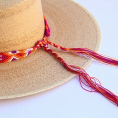 These Beautiful hat bands are carefully hand woven by Rosa in Chiapas,Mexico. Each band showcases a unique and colorful patterned design using traditional macrame techniques. Add a touch of handmade artistry to your hat collection today! Width 1” Length: 23 inches, not including fringe Fringe 9” each side , for an adjustable fit. Fits most hats Polyester yarn All items are shipped from US. All Mi Mundo Mexicano items are 100% handmade by artisans in Mexico. Each stitch and item is completely uni Adjustable Curved Brim Handwoven Panama Hat, Adjustable Woven Hat Band For Vacation, Handwoven Adjustable Curved Brim Panama Hat, Adjustable Woven Hats, Adjustable Woven Hats One Size, Casual Woven Hat Bands For Festivals, Bohemian Braided Brimmed Hat, Festival Woven Sun Hat With Flat Brim, Adjustable Multicolor Toquilla Straw Sun Hat