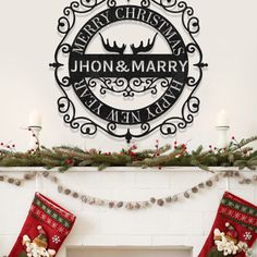 christmas stockings hanging on the mantle in front of a fire place with a merry christmas sign above it