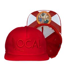 two red and white hats with the word local printed on each hat, one in front of