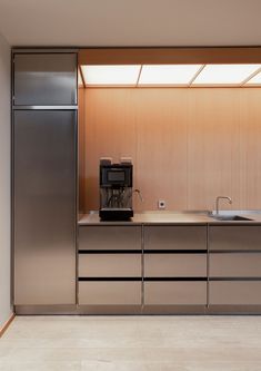 a kitchen with stainless steel appliances and cabinets