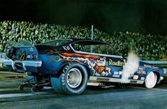 a drag car with flames coming out of it's tires