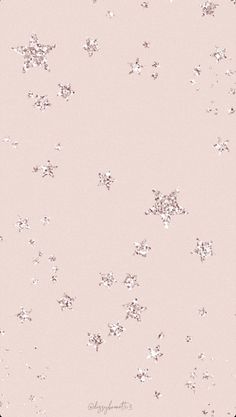 a pink background with small white stars on it