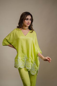 PRODUCT DETAIL: Introducing a vibrant lime green co-ord set, complete with a kaftan-style top that epitomizes breezy summer fashion. The ghera (hem) and pants boast intricate and stunning embroidery, adding a touch of elegance. The captivating color of this set is guaranteed to make you stand out from the crowd. Embrace the allure of this ensemble and make a fashion statement that captures the essence of summertime. SPECIFICATIONS: Color Lime green Fabric Sushi Silk Product Code Sehr17 Linen Cord Sets Women, Coord Set With Embroidery, Indian Attire Modern Casual, Traditional Coord Sets For Women, Indian Coord Set 2023, Embroidery Coord Sets, Kaftan Cord Set, Silk Cord Set Outfit, Silk Coord Sets For Women