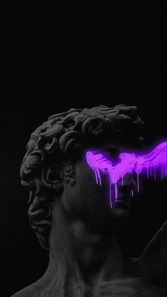 a statue with purple paint on it's face in the dark, next to a black background