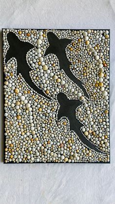 a painting made out of rocks and pebbles