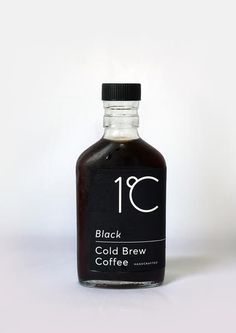 a bottle of black coffee on a white background