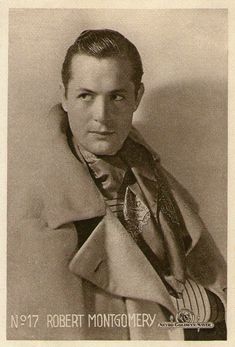 an old black and white photo of a man with a coat over his shoulders wearing a tie