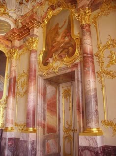 an ornately decorated room with gold trimming