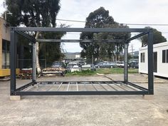 a large metal frame sitting in the middle of a parking lot