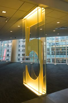 an office building with a large glass sculpture in the center