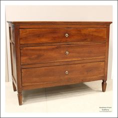 an old wooden dresser with three drawers