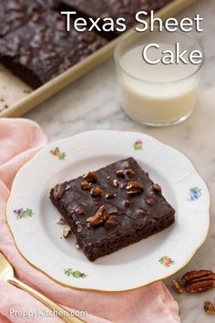 a white plate topped with brownies next to a glass of milk