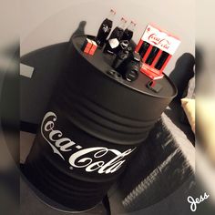 a coca - cola can is sitting on top of a table