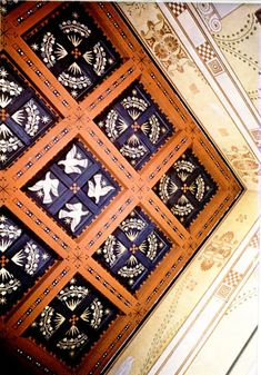 the ceiling is decorated with intricate designs