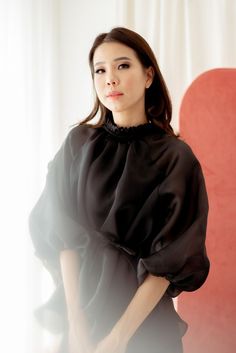 “Command the crowd with this empowering top. The sculptural power of high-low design in layers of dainty black premium organza, puff sleeves, and sweet round neck are designed for the fashionista.” Ruffle Blouse