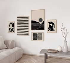 a living room filled with furniture and pictures on the wall above it's coffee table