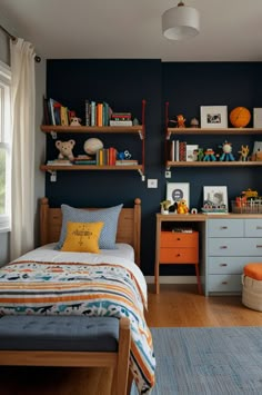 a child's bedroom with blue walls and wooden furniture, including a twin bed