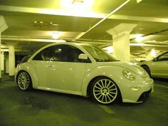 a white car parked in a parking garage