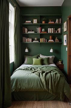 a green bedroom with bookshelves and a bed in the corner, along with two lamps on either side of the headboard