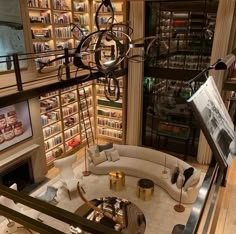 a living room filled with furniture and bookshelves