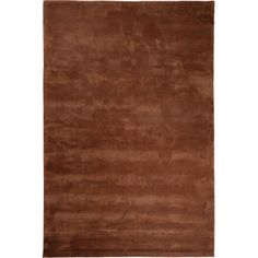 a brown rug on a white background with no one in the room to see it