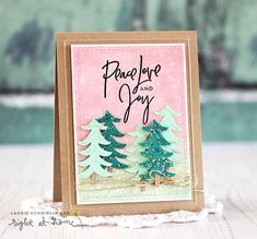 a card with pine trees on it