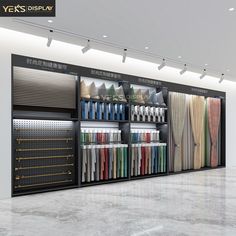 a large display case filled with lots of different colored fabrics