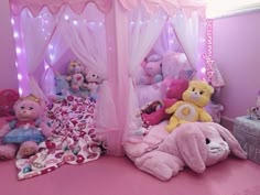 there are many stuffed animals on the bed and in the room with it's canopy