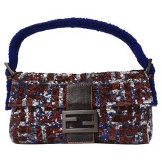 Show stopping Fendi monogram baguette covered in sequins! This stunning handbag features a plethora of navy, silver and ruby brown sequins alongside brown leather and metal Fendi engraved hardware complimented by a navy sherpa handle. Could this bag get any more unique?! This is the perfect statement piece thats begging to be added to your baguette collection. Shine bright on a night out and pair this with your favorite YSL evening dress and Versace pumps or elevate your casual brunch look by ma Fendi Vintage Baguette, Vintage Fendi Baguette, Versace Pumps, Statement Fashion Pieces, Fendi Monogram, Fendi Baguette Bag, Fendi Vintage, Fendi Handbag, Levis Vintage