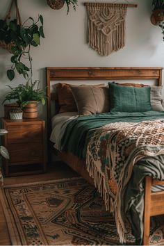 a bed sitting in a bedroom next to a wooden dresser and plant on the wall