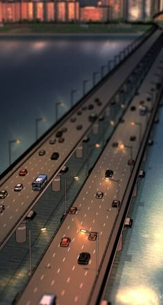 an image of a highway with cars going down the road at night or day time