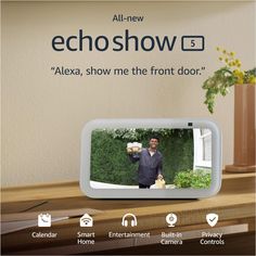 an advertisement for echoshow with a man holding a teddy bear in front of him