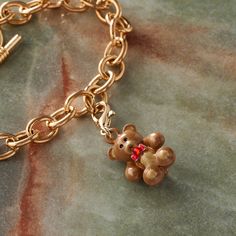 Find the Brown & Gold Teddy Bear Charm by Bead Landing™ at Michaels. This teddy bear charm is perfect for lending your DIY accessory a unique touch. This teddy bear charm is perfect for lending your DIY accessory a unique touch. Show off the finished project with a stylish outfit to complete your ensemble. Details: Brown, red, and gold colored 15 mm charm size Nickel Free Zinc alloy | Brown & Gold Teddy Bear Charm by Bead Landing™ | Michaels® Gold Teddy Bear, Bead Landing, Diy Accessory, Stylish Outfit, Red And Gold, Brown Gold, Zinc Alloy, Gold Color, Teddy Bear