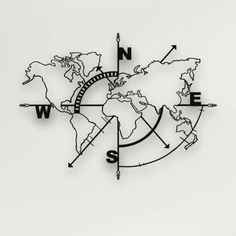 a black and white photo of a compass with the world in it's center