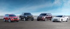 four chevrolet vehicles are lined up in a row