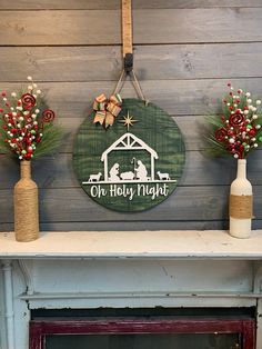 three christmas decorations on top of a fireplace mantel