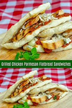 grilled chicken parmesan flatbread sandwiches on a cutting board