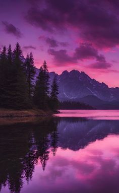 a lake with mountains in the background and purple clouds above it at sunset or dawn