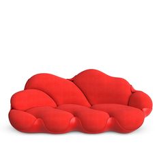 a red couch sitting on top of a white floor