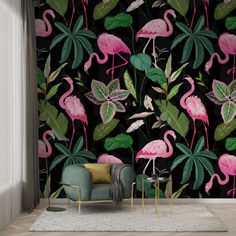 pink flamingos and green leaves on a black background wallpaper in a living room