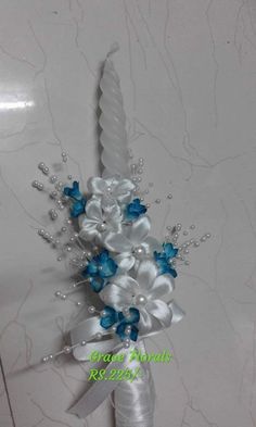 a white and blue wedding bouquet with flowers